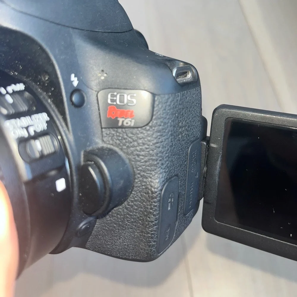 Canon EOS Rebel T6i Digital SLR with EF-S 18-135mm is STM Lens - Wi-Fi Enabled.